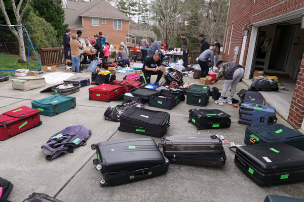 liberia mission trip team suitcases on ground