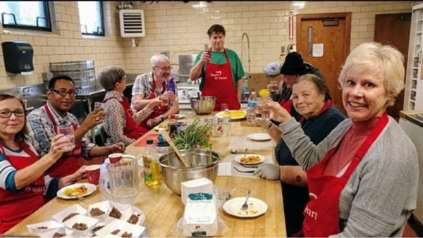 photo of volunteers cooking together
