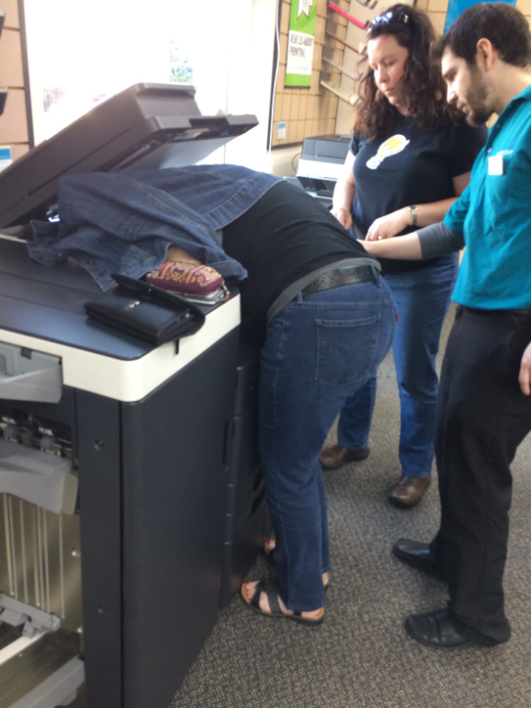 photo of teresa with her head in the copier at Kinkos